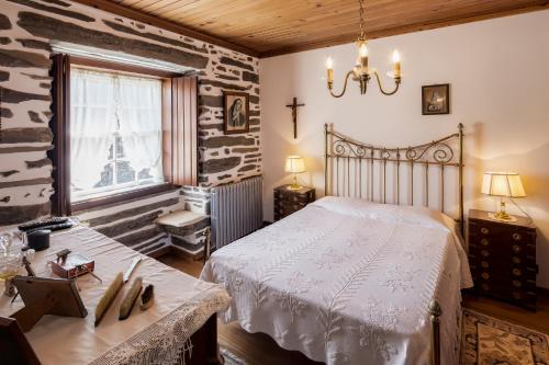 מיטה או מיטות בחדר ב-Quinta de Marrocos