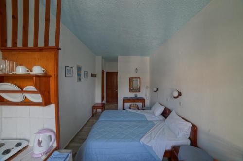 Postel nebo postele na pokoji v ubytování Nefeli Hotel
