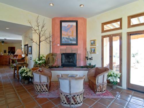 a living room with a couch and a fireplace at Borrego Valley Inn in Borrego Springs