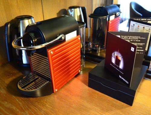 a toaster sitting on top of a wooden table at Palais de Chine Hotel in Taipei