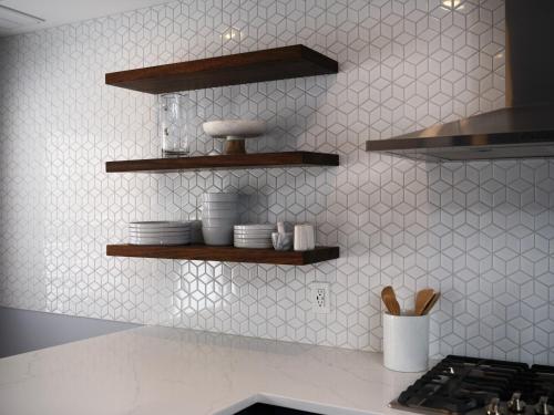 a kitchen with wooden shelves on the wall at The Lambertville Haven in Lambertville