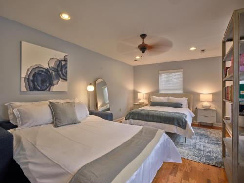 a bedroom with two beds and a ceiling fan at The Lambertville Haven in Lambertville