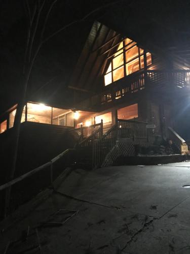 a building at night with the lights on at Bears Lair cabin Chalet in Sevierville