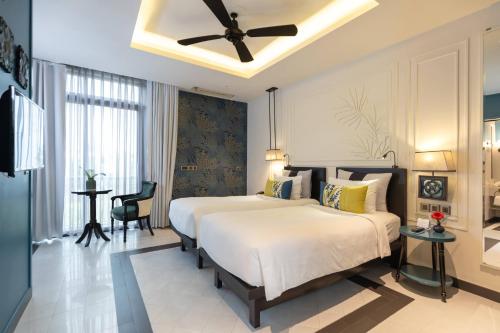 Maison Vy Hotel Hội Anにあるベッド