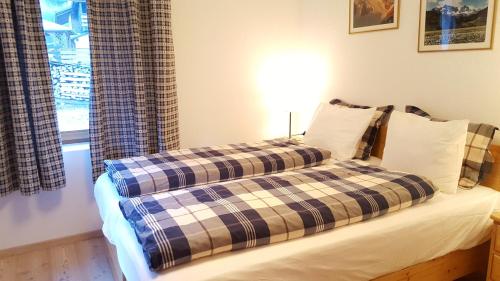 Letto o letti in una camera di Casa Alfredino