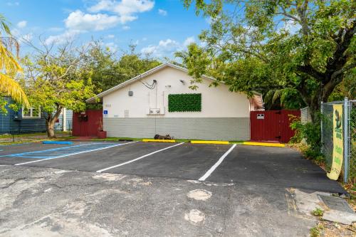 a parking lot in front of a house at Crocodhouse early check in eight years hosting in Fort Lauderdale