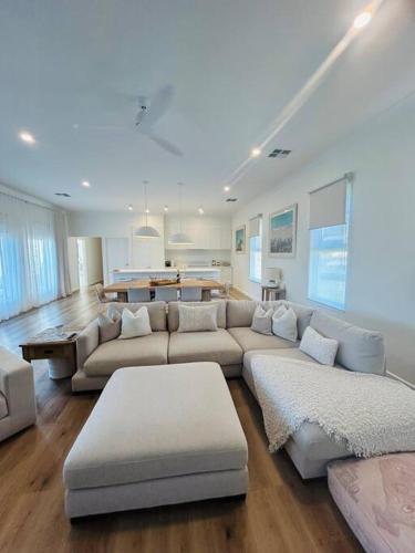 a large living room with a couch and a table at Perranwell House - Aldinga Village in Aldinga