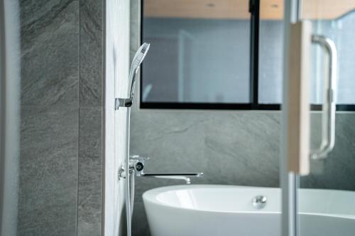 Ein Badezimmer in der Unterkunft みらいステイKawachi