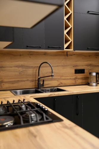 a kitchen with a sink and a counter top at Gardeni Guest House in Garni