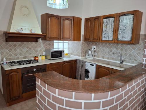 Η κουζίνα ή μικρή κουζίνα στο Villa Elisir