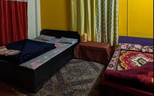 Ένα ή περισσότερα κρεβάτια σε δωμάτιο στο DP Homestaayz By StayApart