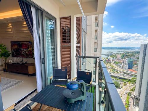 a balcony with a view of a city at R&F Princess Cove by Nest Home at Johor Bahru in Johor Bahru