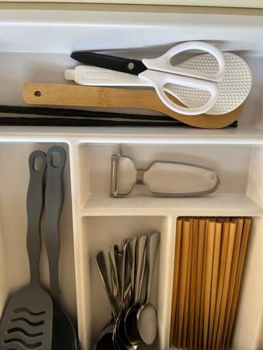 a drawer filled with kitchen utensils and other items at 広々な140平米 in Nagoya