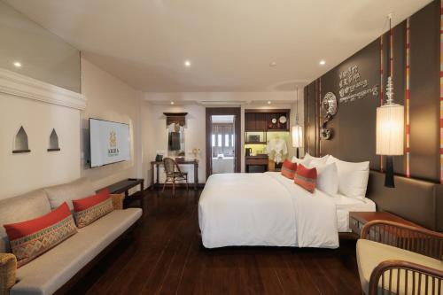 Ένα ή περισσότερα κρεβάτια σε δωμάτιο στο Akira Thaphae Hotel