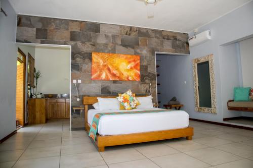 Кровать или кровати в номере Domaine Desaubin Luxury Villas