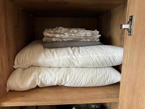 a group of pillows are stacked in a closet at Il Sogno terrazza panoramica in Massino Visconti