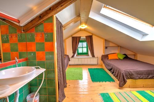 a bathroom with a bed and a sink in a room at Rural Villas Crikvenica in Crikvenica