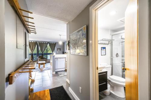 a bathroom with a sink and a toilet in a room at Pinnacle E15 in Killington