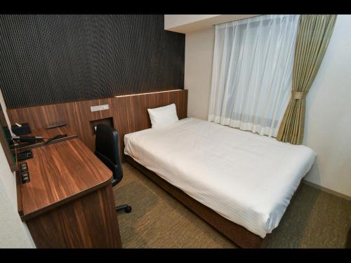 Кровать или кровати в номере Sanco Inn Osaka Yodoyabashi
