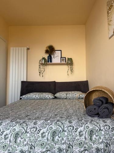 a bedroom with a large bed with a blanket at Il Sogno terrazza panoramica in Massino Visconti