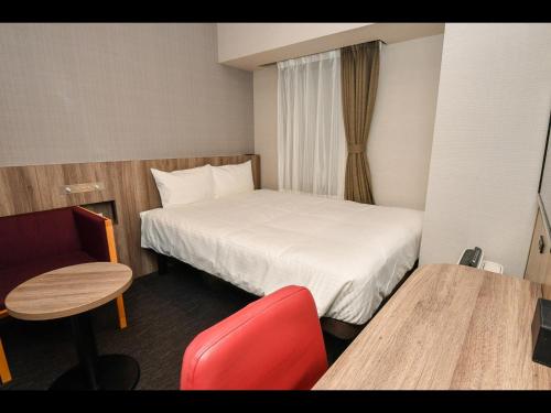 Кровать или кровати в номере Sanco Inn Osaka Yodoyabashi
