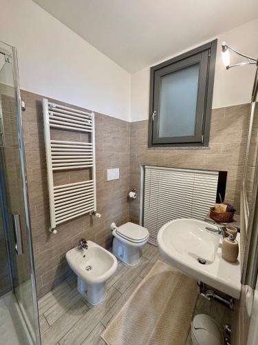 a bathroom with a sink and a toilet at Il Sogno terrazza panoramica in Massino Visconti