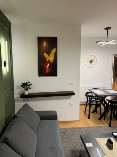 a living room with a couch and a table at LiboroApartments in Niš