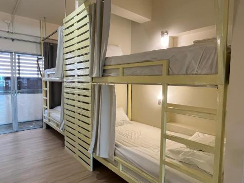 a group of bunk beds in a room at Wonderful inn 2 in Pattaya Central