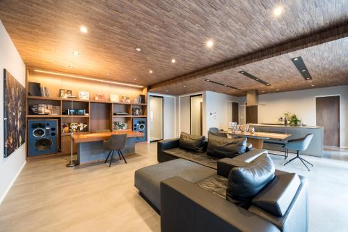 a living room with a couch and a table at Buena Vista Ohori Park in Fukuoka