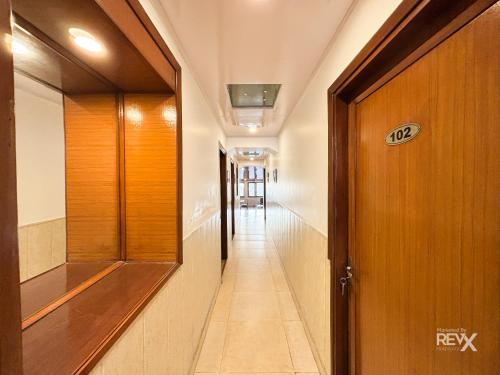 a hallway with a door leading to a hallway sidx sidx sidx at Hotel Sunny Cot - Free Mall Shuttle and Parking in Mussoorie