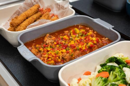 a dish of food with meat and vegetables on a table at Hotel Keihan Asakusa in Tokyo