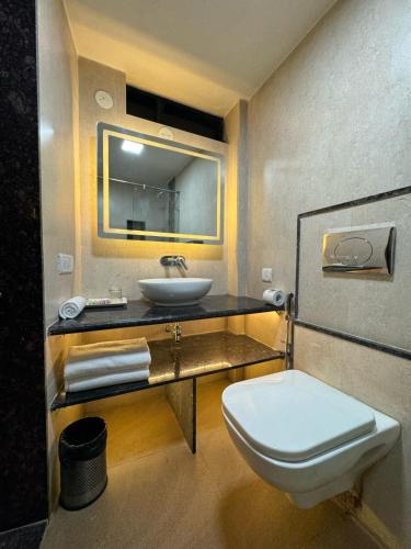 a bathroom with a sink and a toilet at Upper Deck Resort - Highest Peak, Lonavala in Lonavala