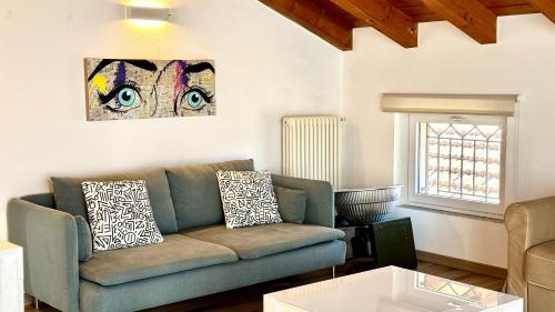 a living room with a couch and a window at AxelParkComo in Como
