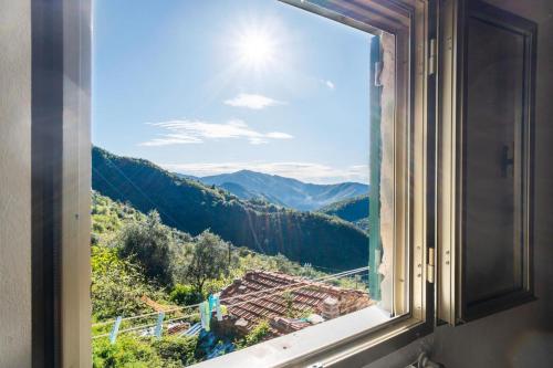 a window with a view of a mountain at Room in the Country House in Argallo