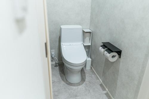 Ein Badezimmer in der Unterkunft みらいステイKawachi