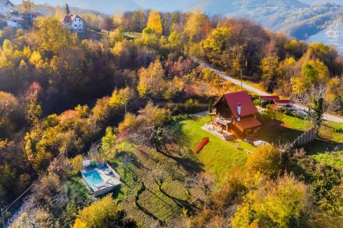 an aerial view of a house in a forest at Hilltop Panorama Chalet - Happy Rentals in Samobor