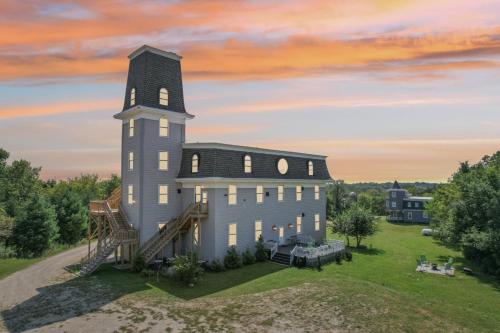 an aerial view of a building with a tower at The Starlight Tower Manor, River, Arcades, Observatory, Theater in Fort Atkinson