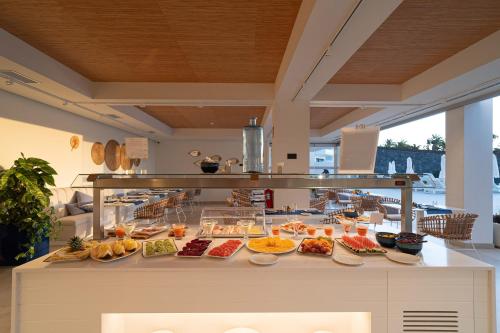 a buffet line with many different types of food at Royal Marina Suites Boutique Hotel - Adults Only in Puerto Calero