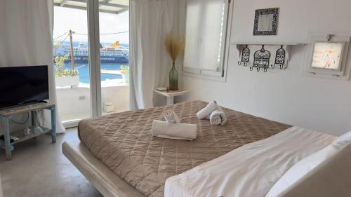 Postel nebo postele na pokoji v ubytování Mykonos Seaview Nests - Tourlos Getaways