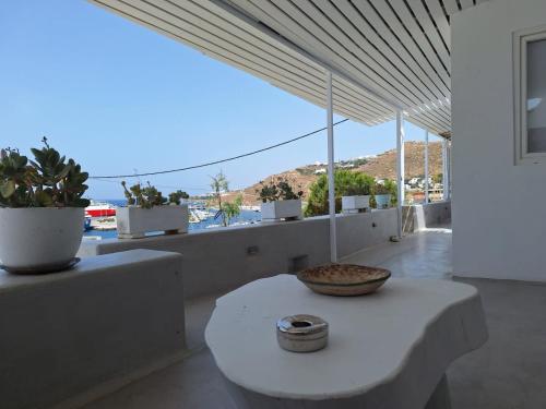 a room with a table with a bowl on it at Mykonos Seaview Nests - Tourlos Getaways in Tourlos