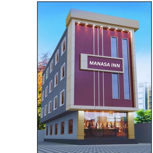 a rendering of a building with a manama inn sign on it at Manasa Inn in Palakkad