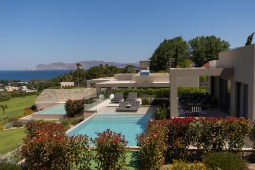 a view of a house with a swimming pool at Maravilla Luxury Living in Kos Town
