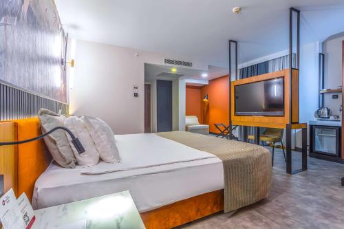 Katil atau katil-katil dalam bilik di Best Western Plus Khan Hotel