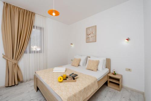 Ένα ή περισσότερα κρεβάτια σε δωμάτιο στο Arvala Apartments