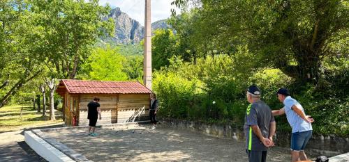a group of people playing a game of frisbee at Camping Le Saint Clair in Moustiers-Sainte-Marie