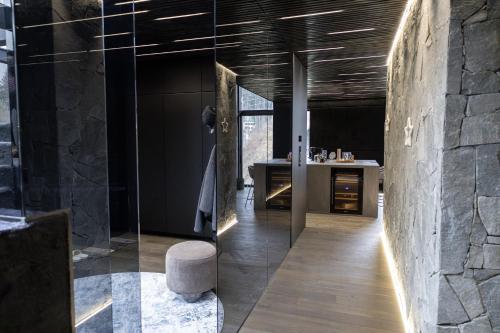 a bathroom with a glass walled shower and a counter at BÚDA Jasná in Demanovska Dolina