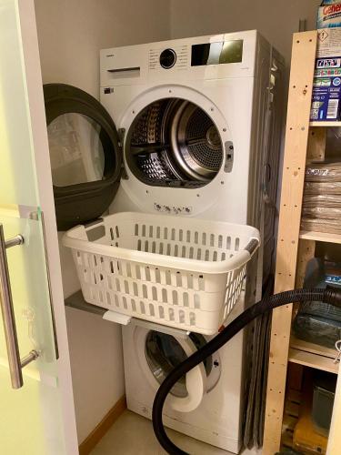 a washing machine and a washer in a laundry room at Abbihouse & Castle in Abbiategrasso
