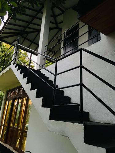 a staircase leading up to a building with windows at Talalla Wonder View in Talalla South