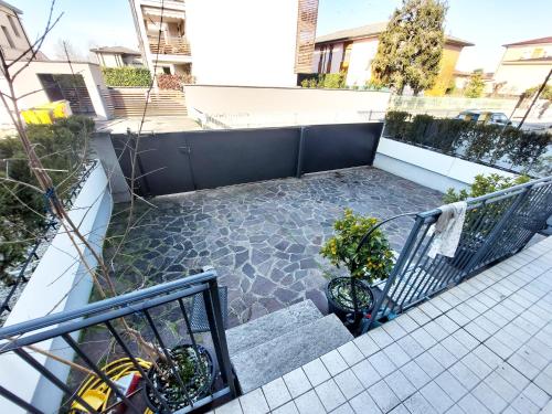 a balcony with stairs and plants on a building at CasaOlivier appartamento con giardino e biciclette in Crema