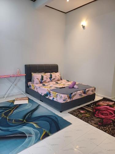 a bedroom with a bed in a room at MAA Roomstay C in Kuala Terengganu